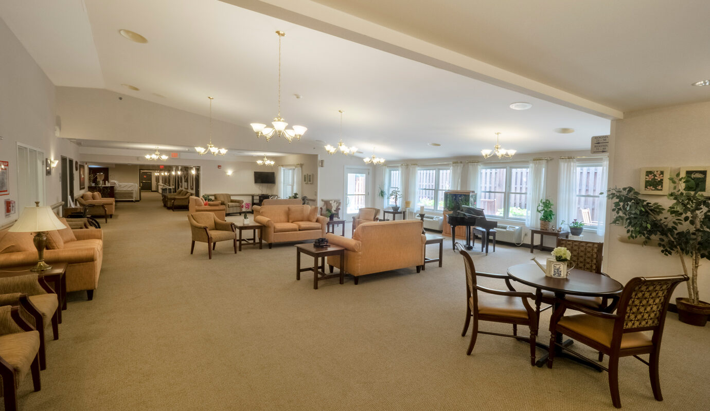 Common area with seating and grand piano