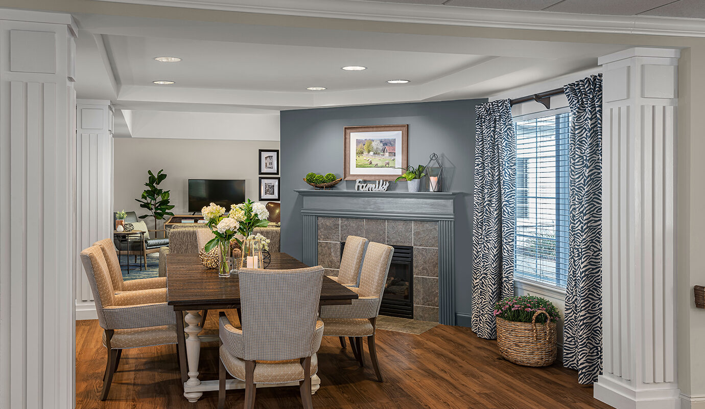 Large dining table near fireplace