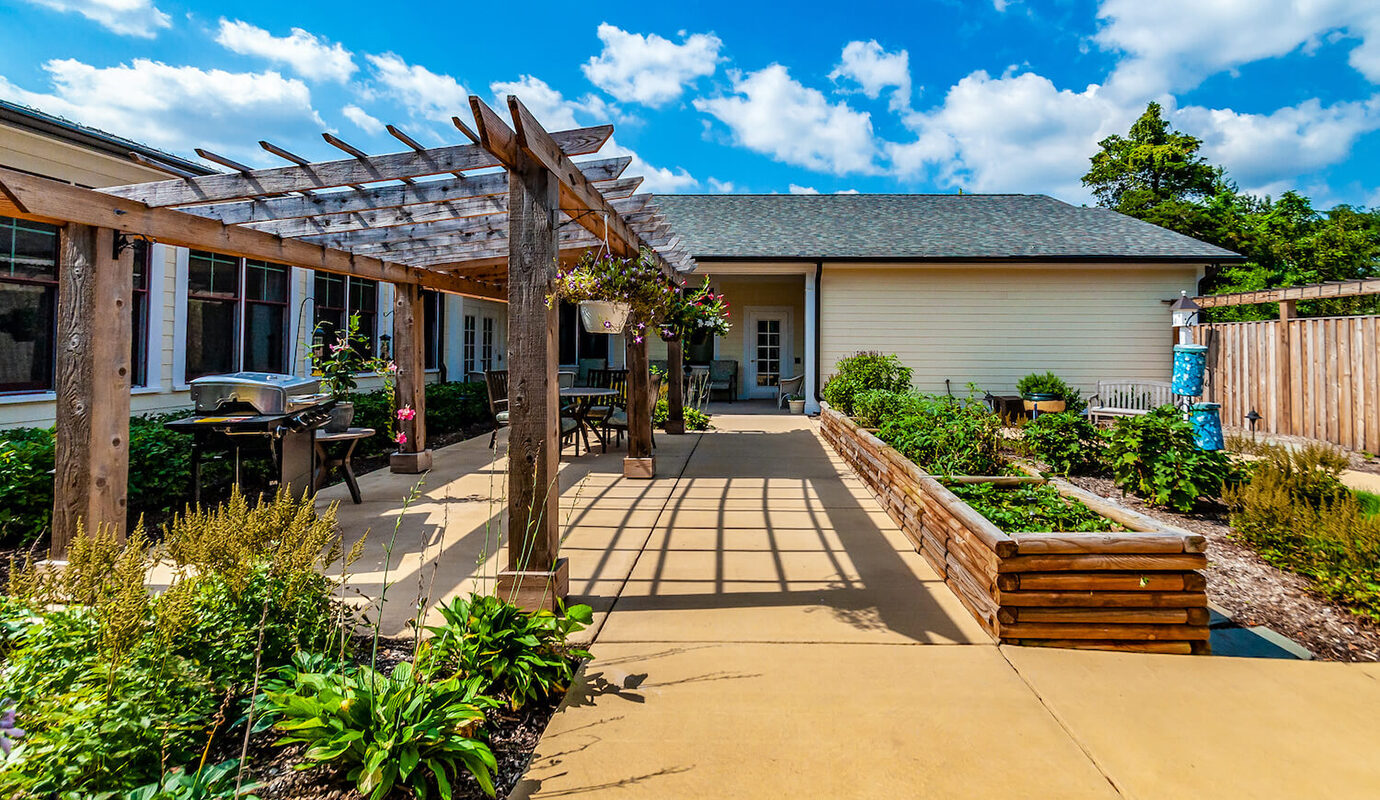 Pergola patio with garden and grill