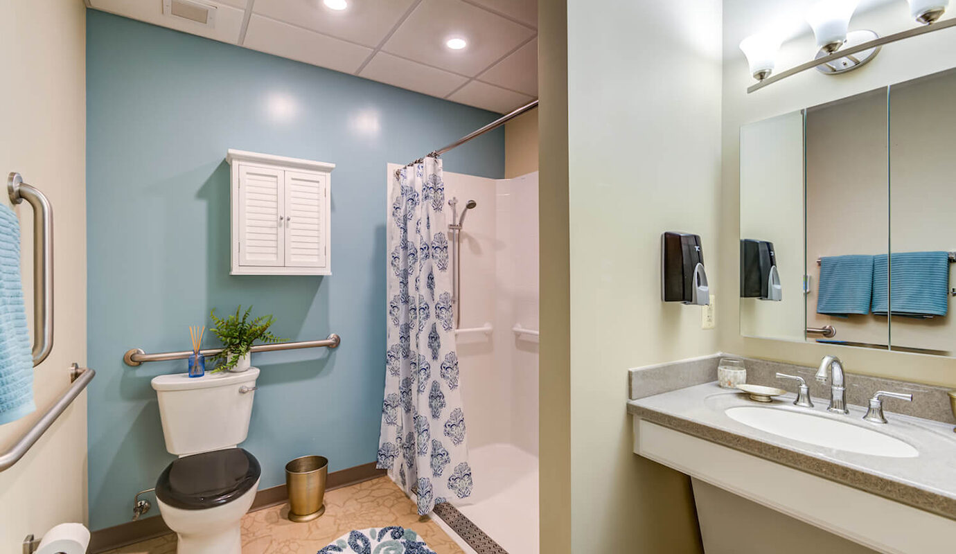 Decorated bathroom with walk in shower