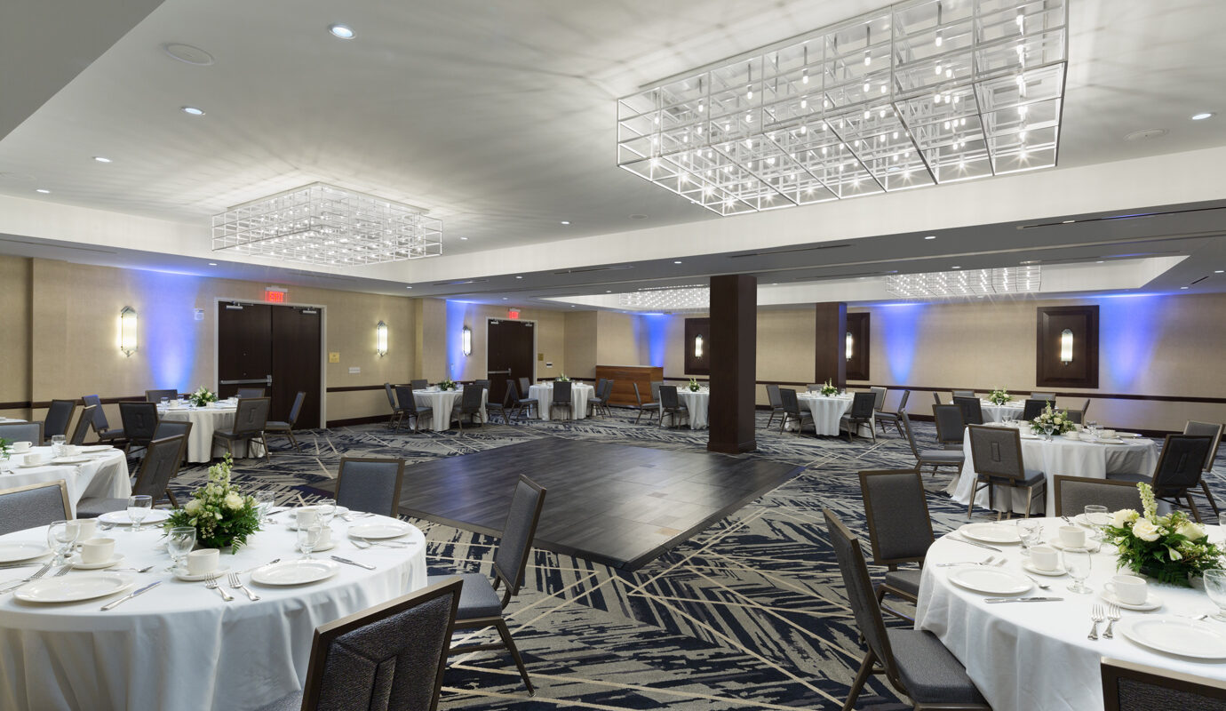 Brand ballroom with dance floor and dining tables