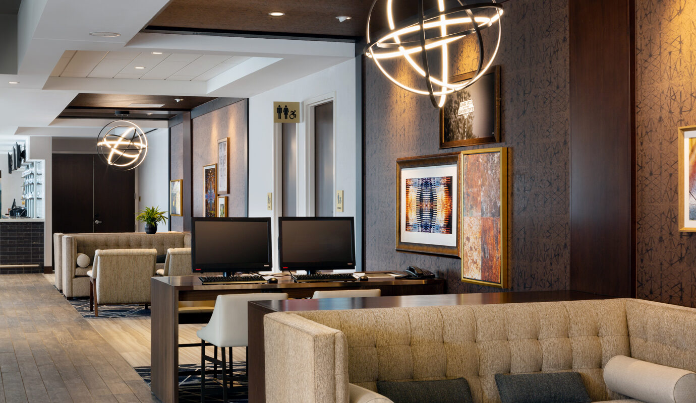 Lobby area with computers and seating near check in
