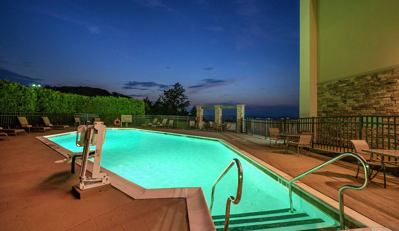 Outdoor pool with lift and deck seating
