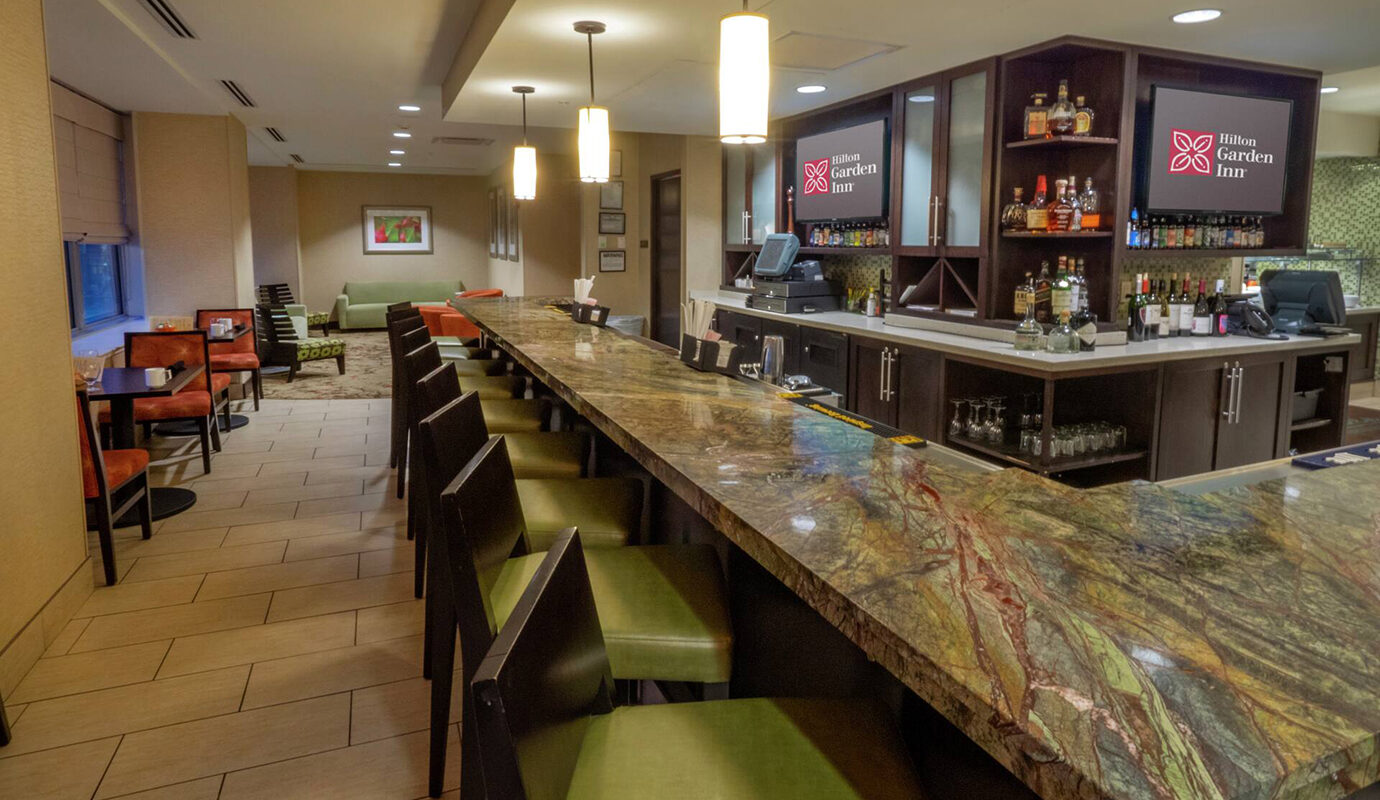 Bar with bar top seating and side tables