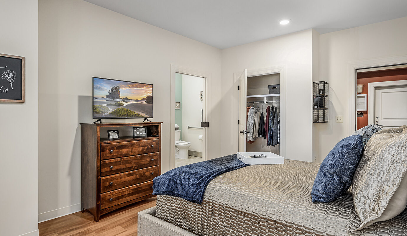 Decorated bedroom with bed and dresser