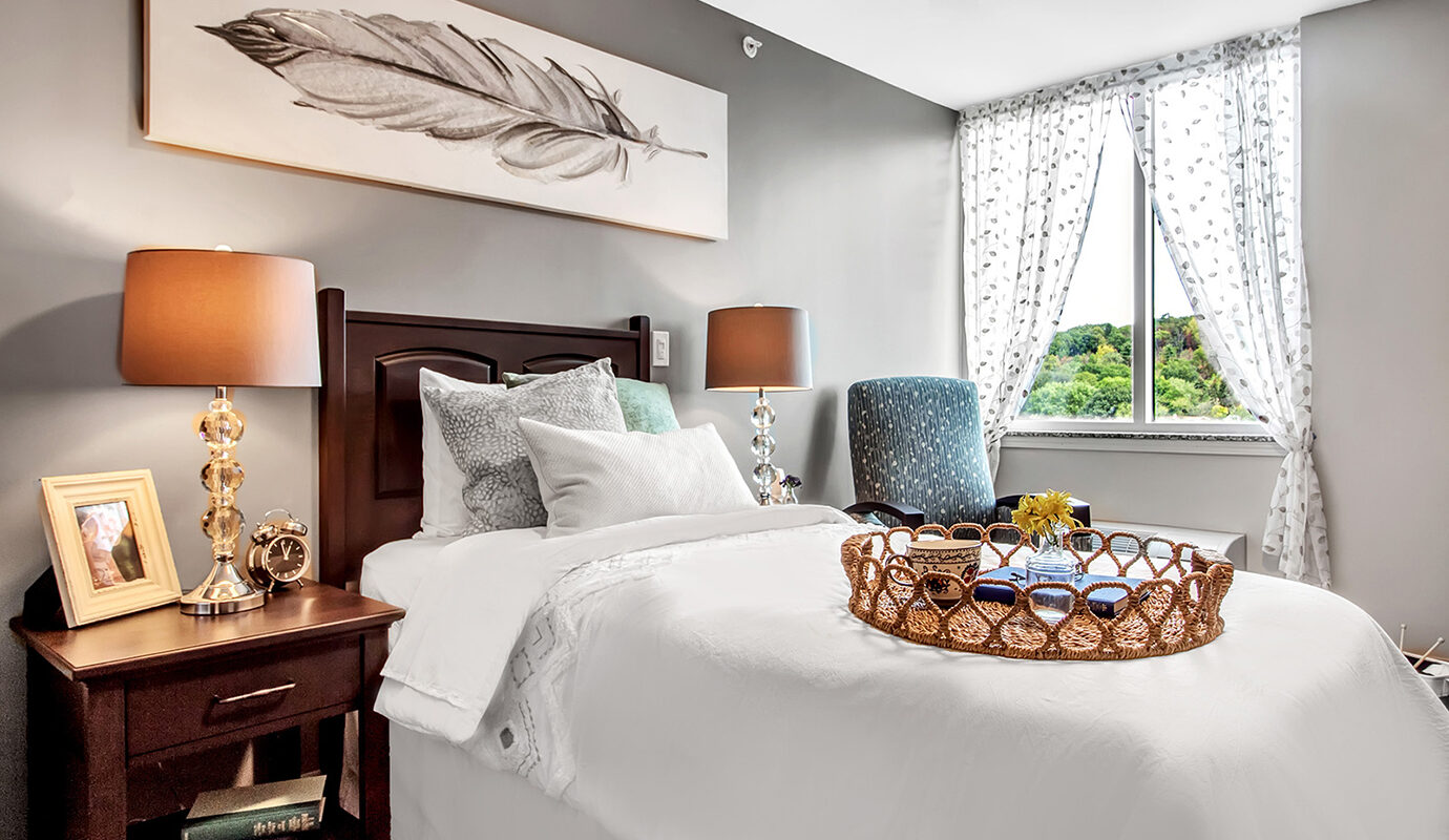 Twin size bed with side tables and decor