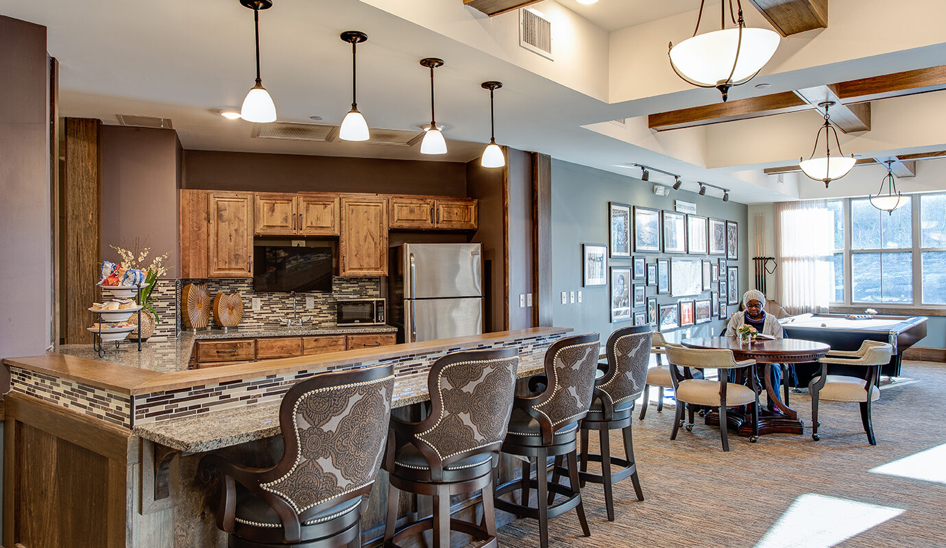 Kitchenette with bar seating and pool table