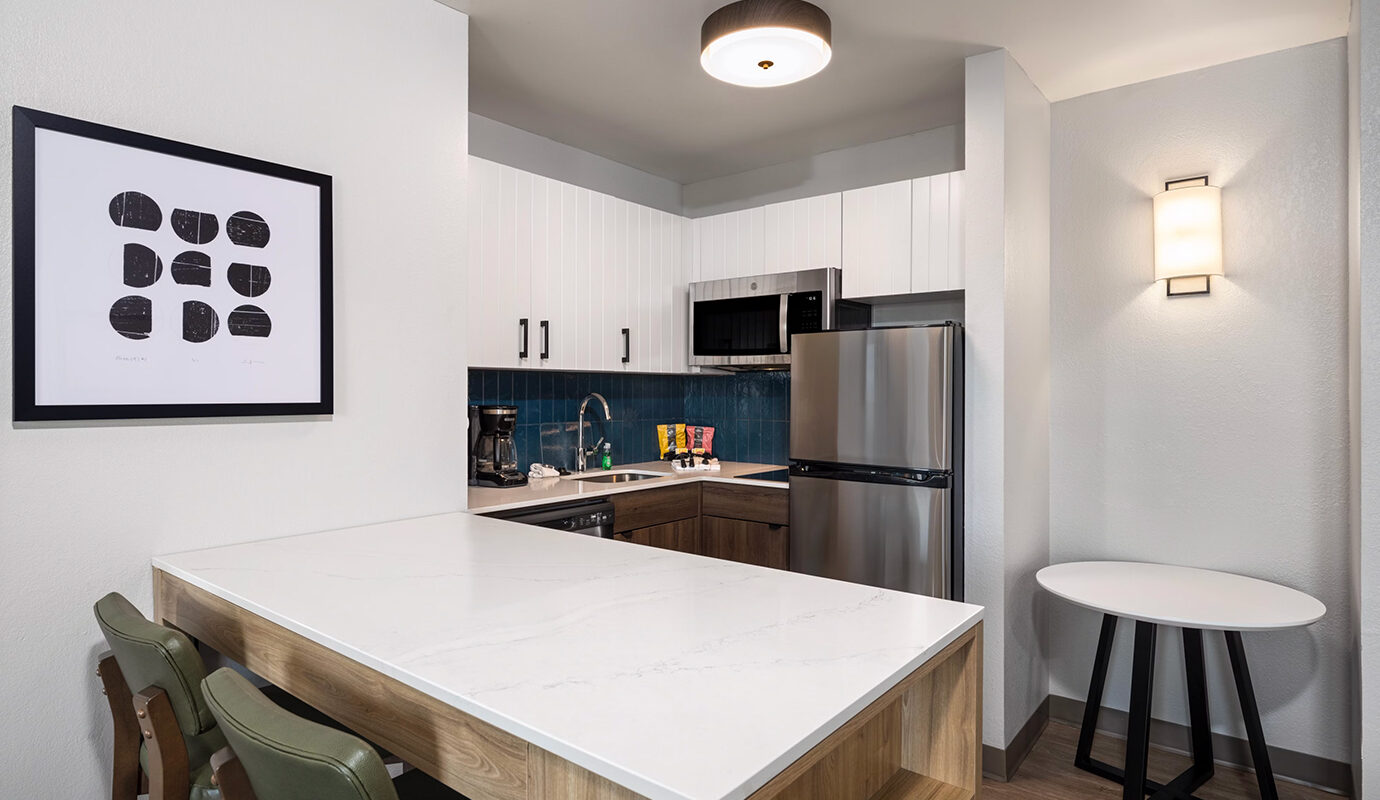 Kitchenette and island dining area in guest room