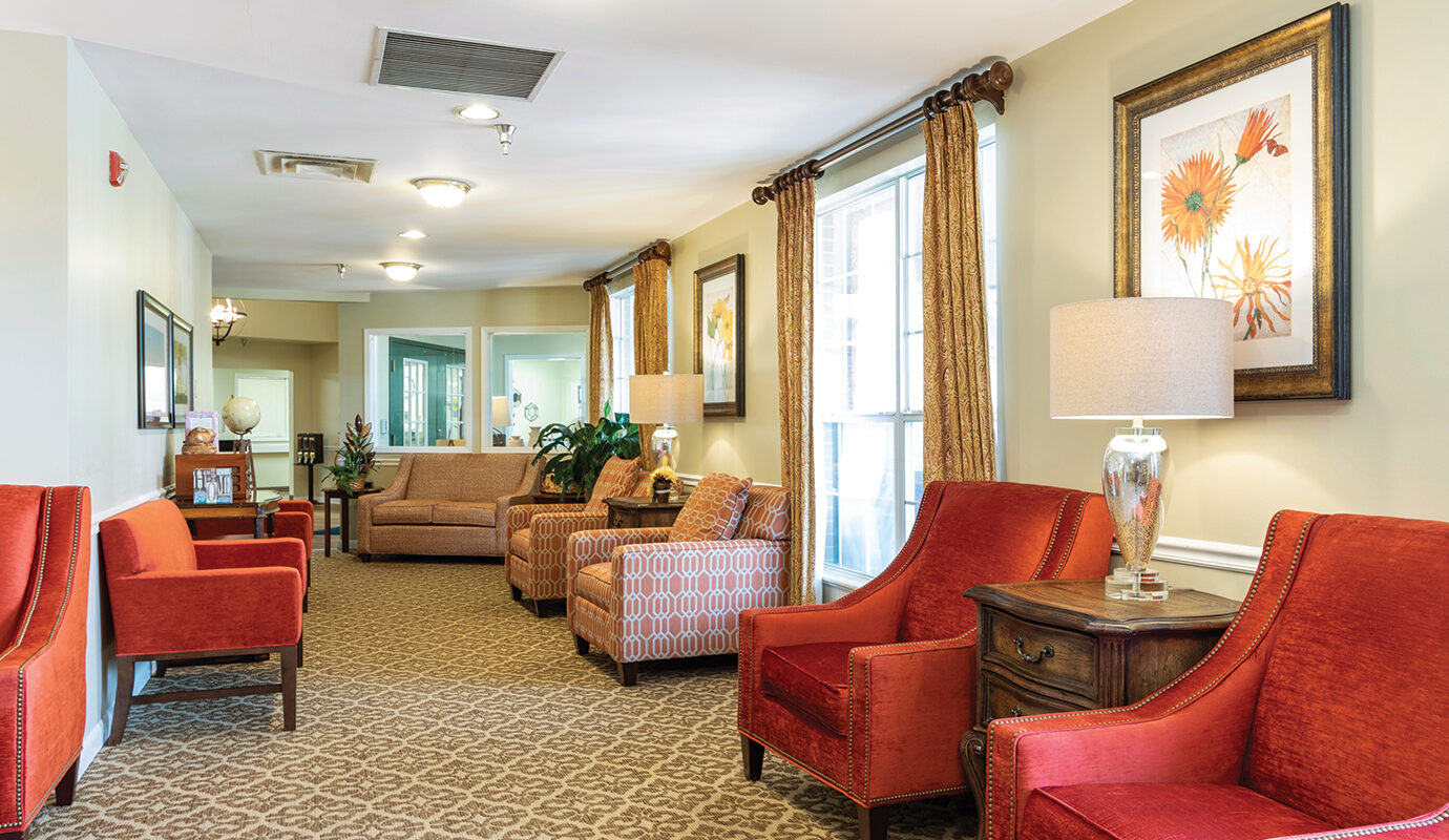Lobby area in hotel with lots of couches and seating