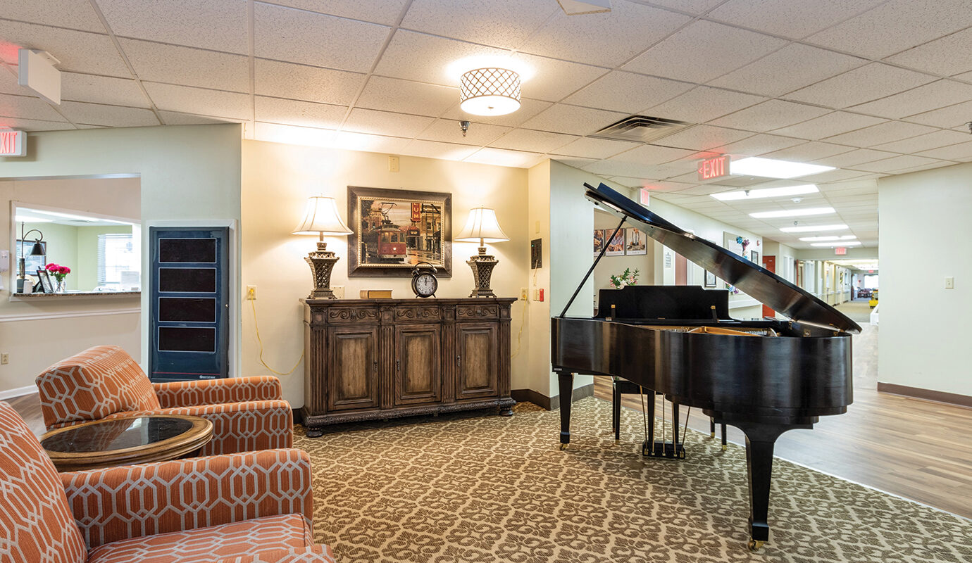 Hotel lobby area with seatings and grand piano