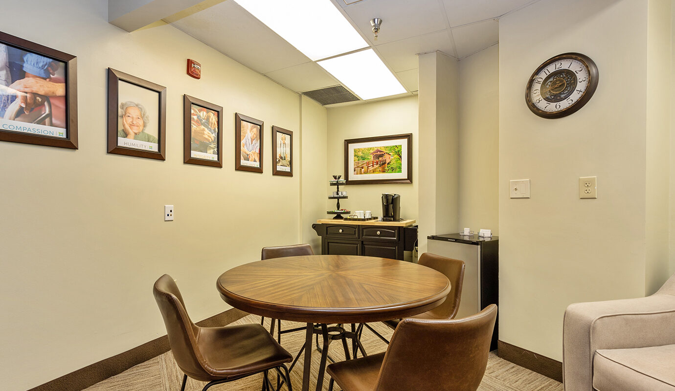 Small cafe area in hotel with smal table and chairs