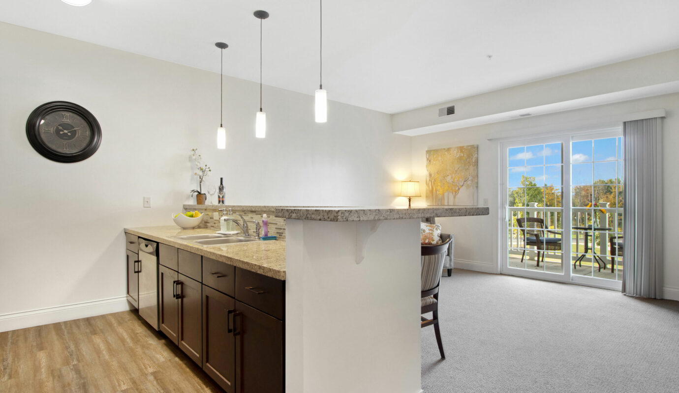 living room and patio view at orchard heights independent living apartment